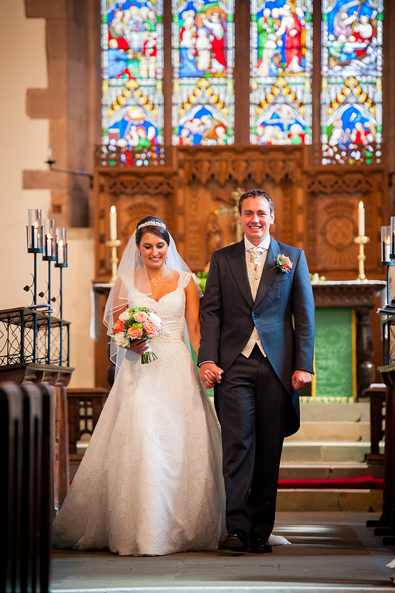 Wedding photographer Ruthin Celynnen Photography The bride and groom walking out of the church