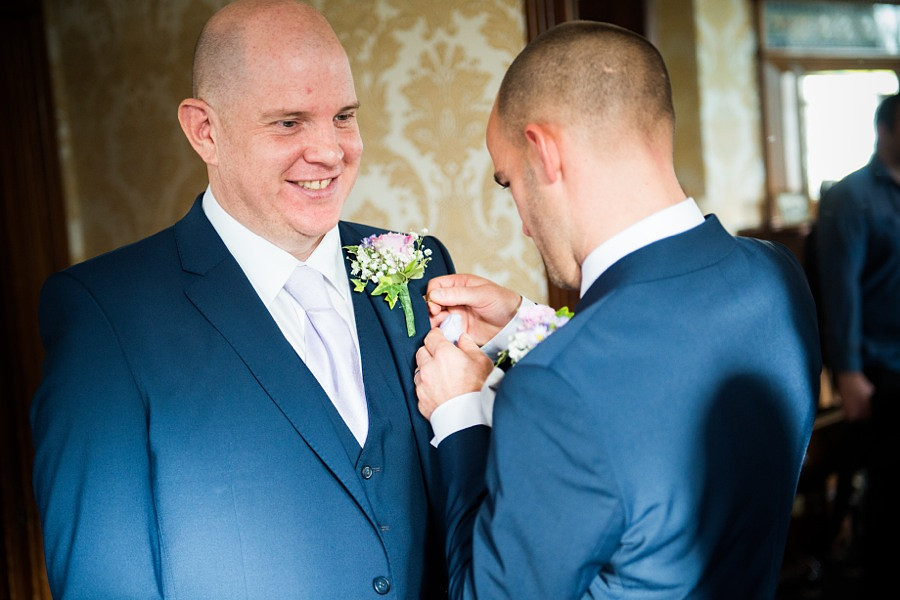 Groom preparing for wedding by North Wales Wedding Photographer Celynnen Photography