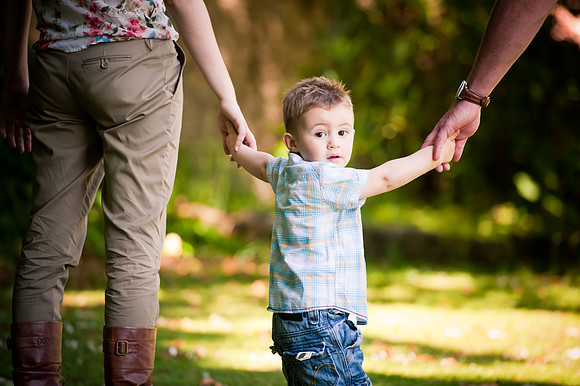 A young boy with his parents on a pre wedding photoshoot in Denbigh