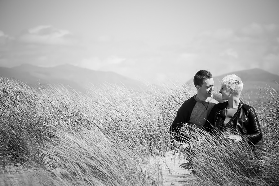 Photograph of Liz & Jason in black & white looking at each other, photographed for pre wedding shoot by Celynnen Photography.