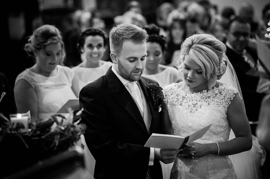 Bride and Groom at Altar by Photographer Celynnen Photography