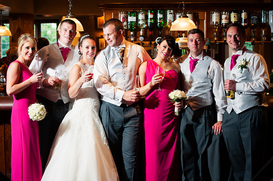 Group photo of the bride, groom, ushers and bridesmaids at a wedding at Grosvenor Pulford