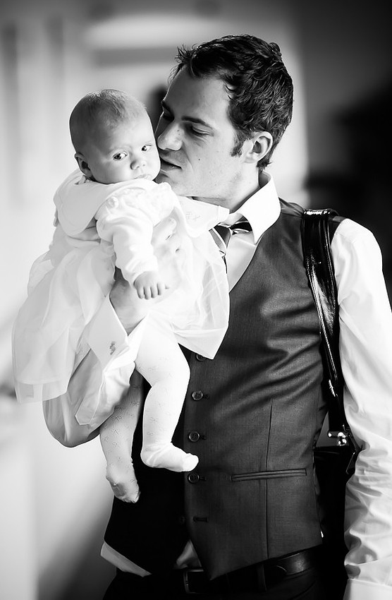 Black & white photograph of Amelia with Daddy after her Christening, taken by Celynnen Photography.