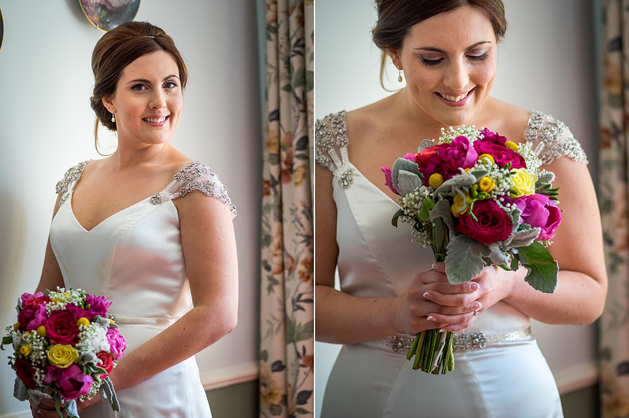 Amy in her Maggie Soterro dress with her flowers from Bluebells in Llanfair PG before her wedding in Beaumaris