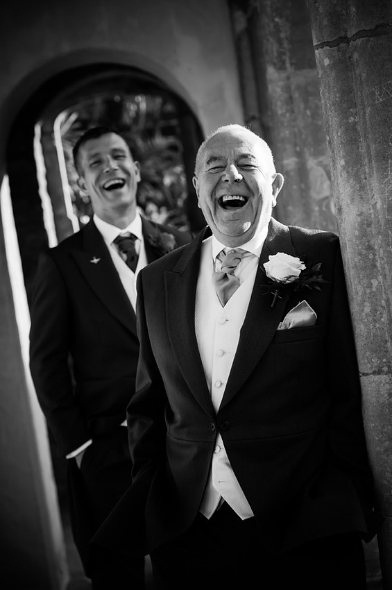 Groom and guest enjoying their time at a wedding in Portmeirion.