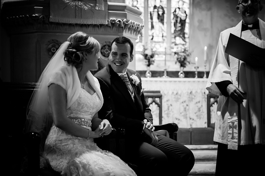Bride and Groom Smiling at Altar by North Wales Wedding Photographer Celynnen Photography