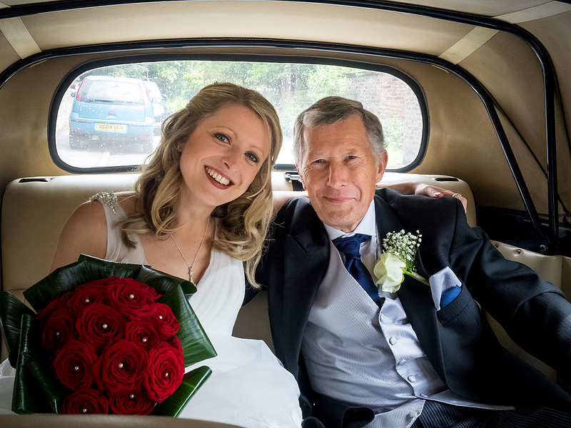 Photo of the bride and her father arriving for the wedding ceremony in Davenham.