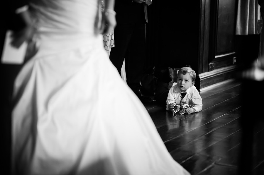 Child looking at Bride at Wedding by Photographer Celynnen Photography