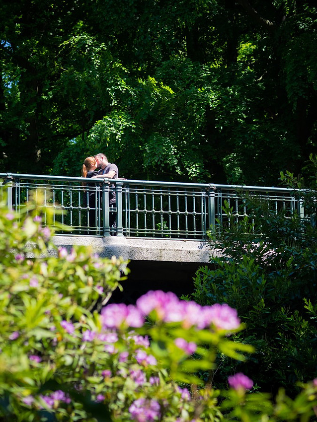 Photograph of Claire & Paul standing on a bridge in Sefton Park, Liverpool during their Pre Wedding Shoot.