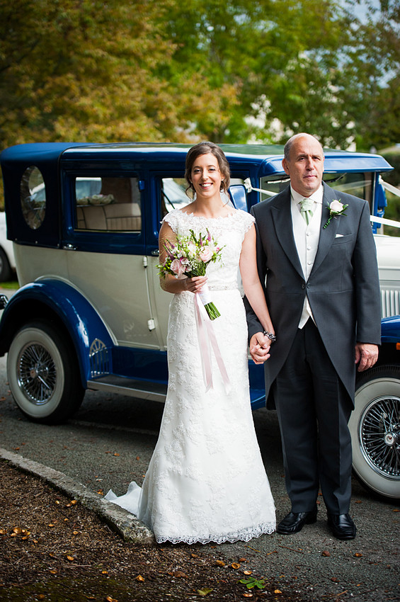 Bride and her Father in front of Wedding Car by North Wales Wedding Photographer Celynnen Photography
