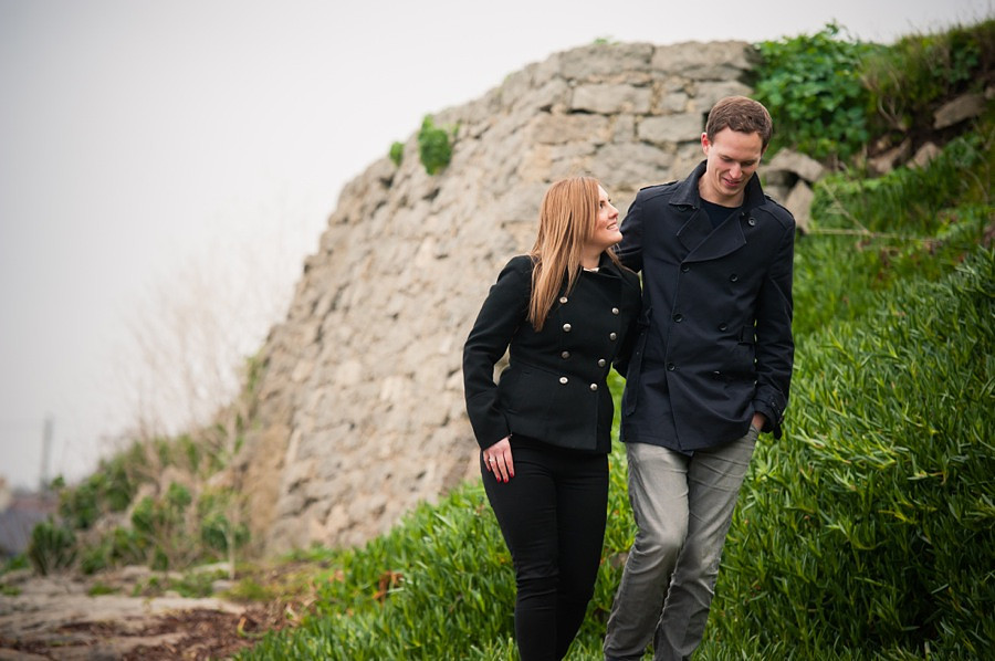Picture of engaged couple walking towards the camera in their pre wedding shoot.