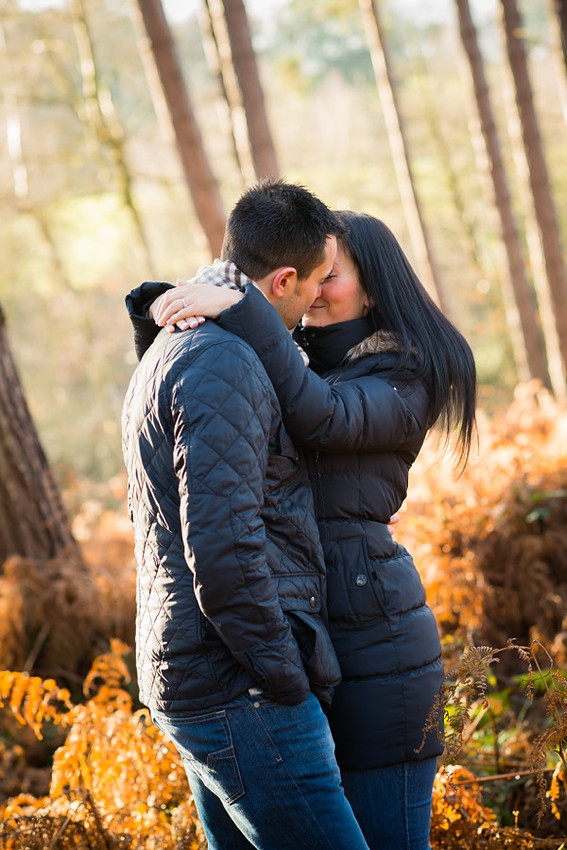 Photo of engaged couple about to kiss on their pre wedding shoot in Delamere Forest.