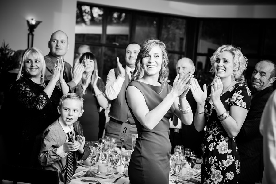 Guests clapping for couple at wedding by North Wales Wedding Photographer Celynnen Photography
