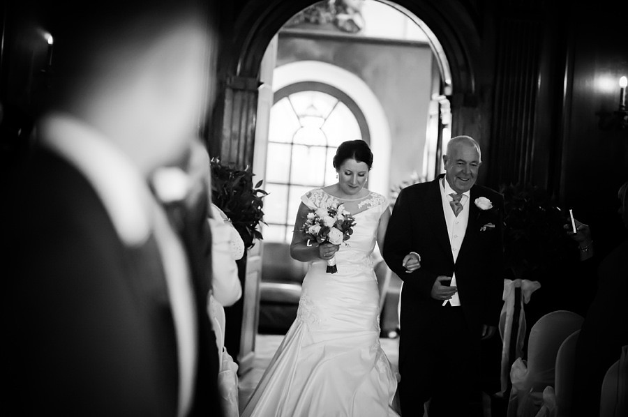 Bride-to-be walking down the aisle by North Wales Photographer Celynnen Photography