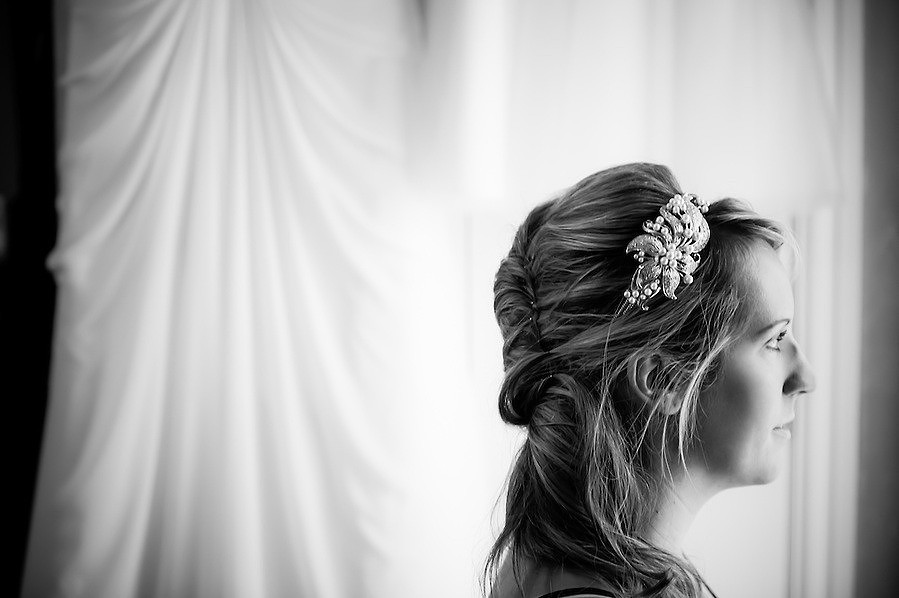 Black and white image of the bride during bridal preparations for her wedding in Portmeirion.