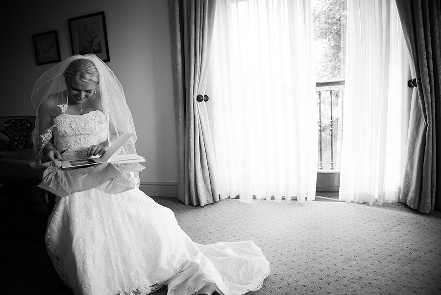 The bride in the bridal suite at Seiont Manor, Caernarfon. Wedding photographer: Celynnen Photography