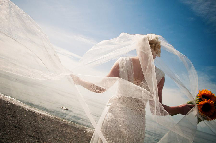 The bride and her veil at Nant Gwrtheyrn by Celynnen Photography