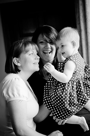 Black and white portrait of a young girl and her parents on a family photoshoot
