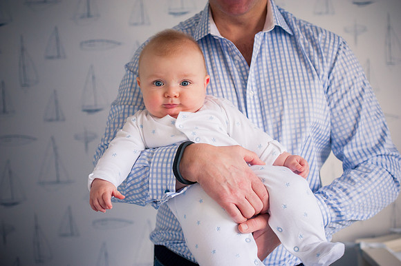 Portrait of baby with their dad for a bump to baby photoshoot with Celynnen Photography