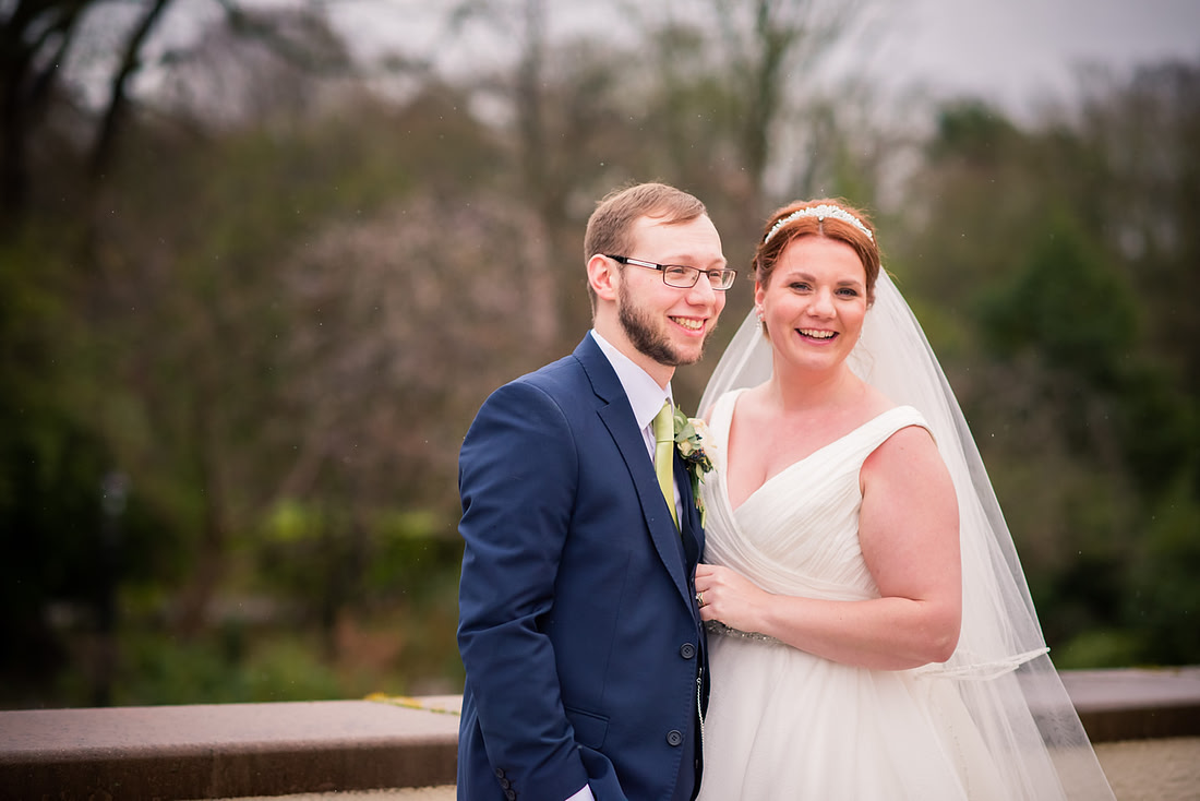 Portrait of the bride and groom in the grounds of Mere Brook House.