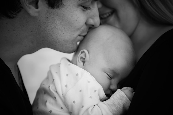 Dad giving his baby a kiss during a portrait photoshoot with Celynnen Photography