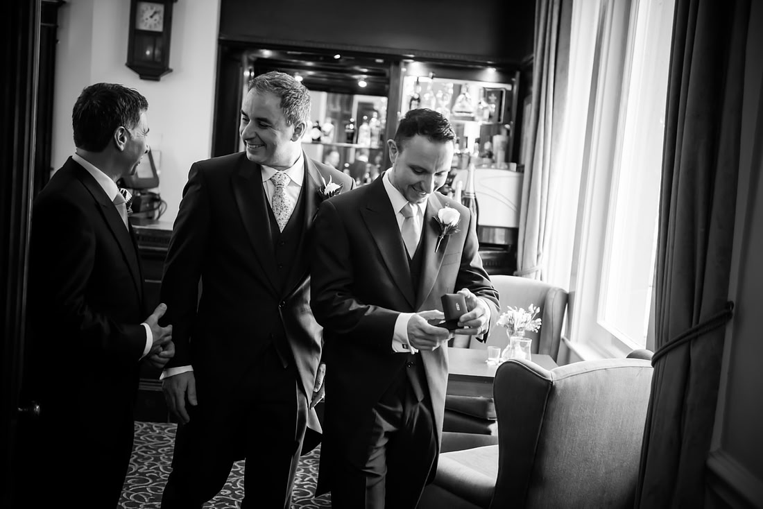 Black and white image of the groom and his ushers before the wedding at Taplow House.