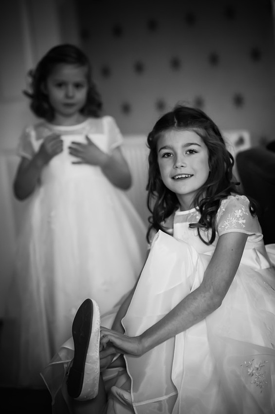 Flower girls getting ready for the wedding by Photographer Celynnen Photography