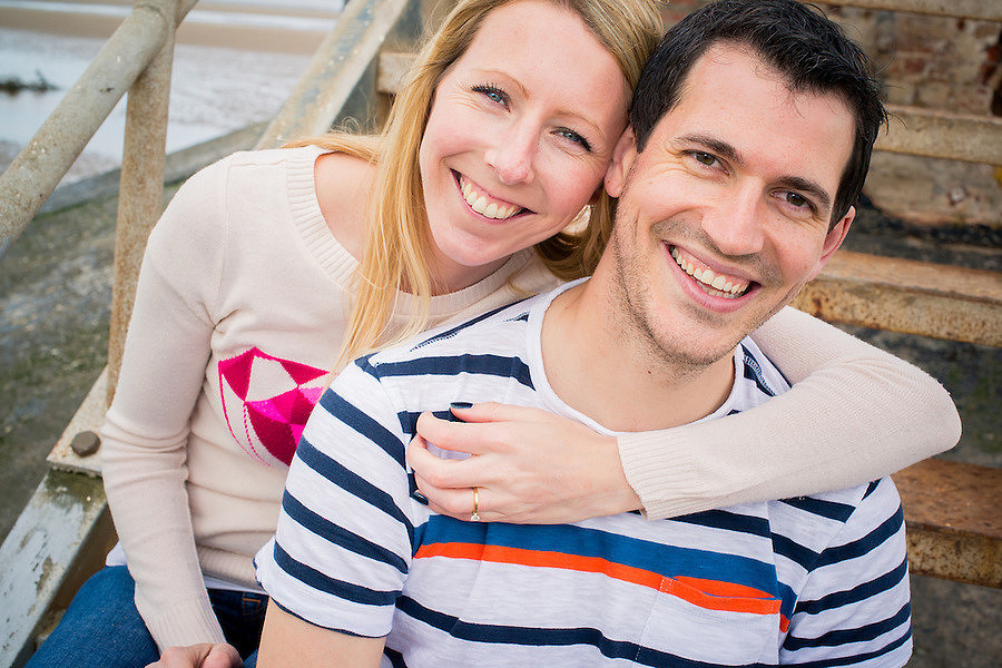 A happy engaged couple on their pre wedding photoshoot on Talacre Beach.