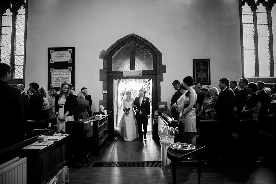 Wedding photographer Ruthin Celynnen Photography , bride entering church with her father